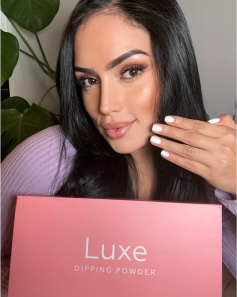 woman with luxe dip powder nail kit